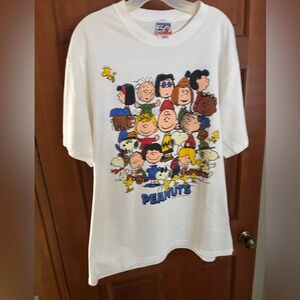 Peanuts-White Graphic T-Shirt. Preshrunk cotton fabric made in USA. Never worn.